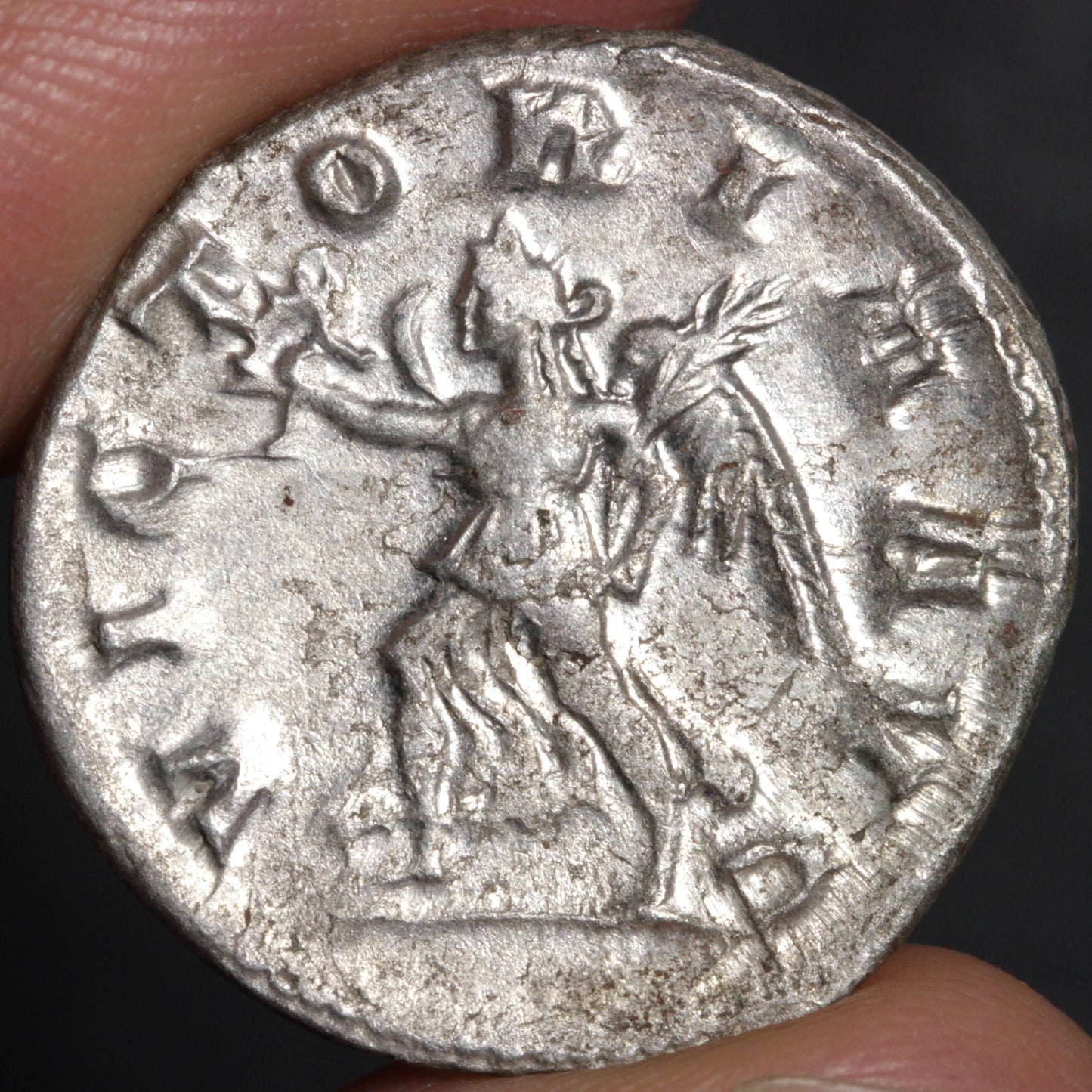 reverse side of herennia etruscilla antoninianus, showing goddess winged victory