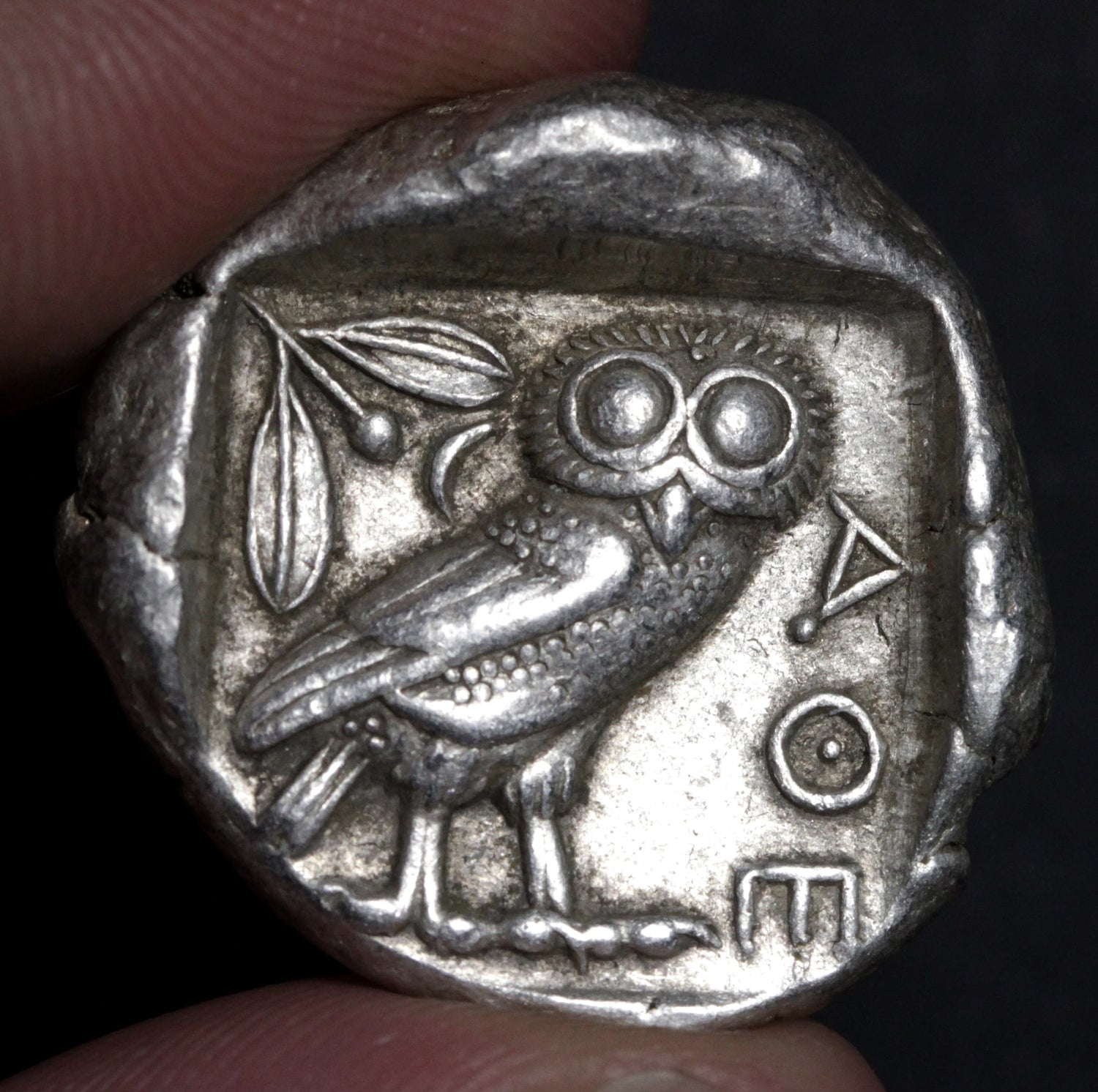 Reverse side of an ancient Athens tetradrachm coin, featuring an owl