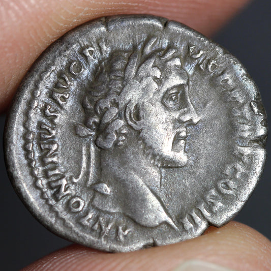 obverse side of the coin, featuring the portrait of Antoninus Pius
