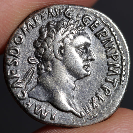 obverse side of domitian denarius showing portrait of domitian