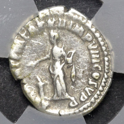 Ancient silver coin with a figure and inscriptions on a gray background