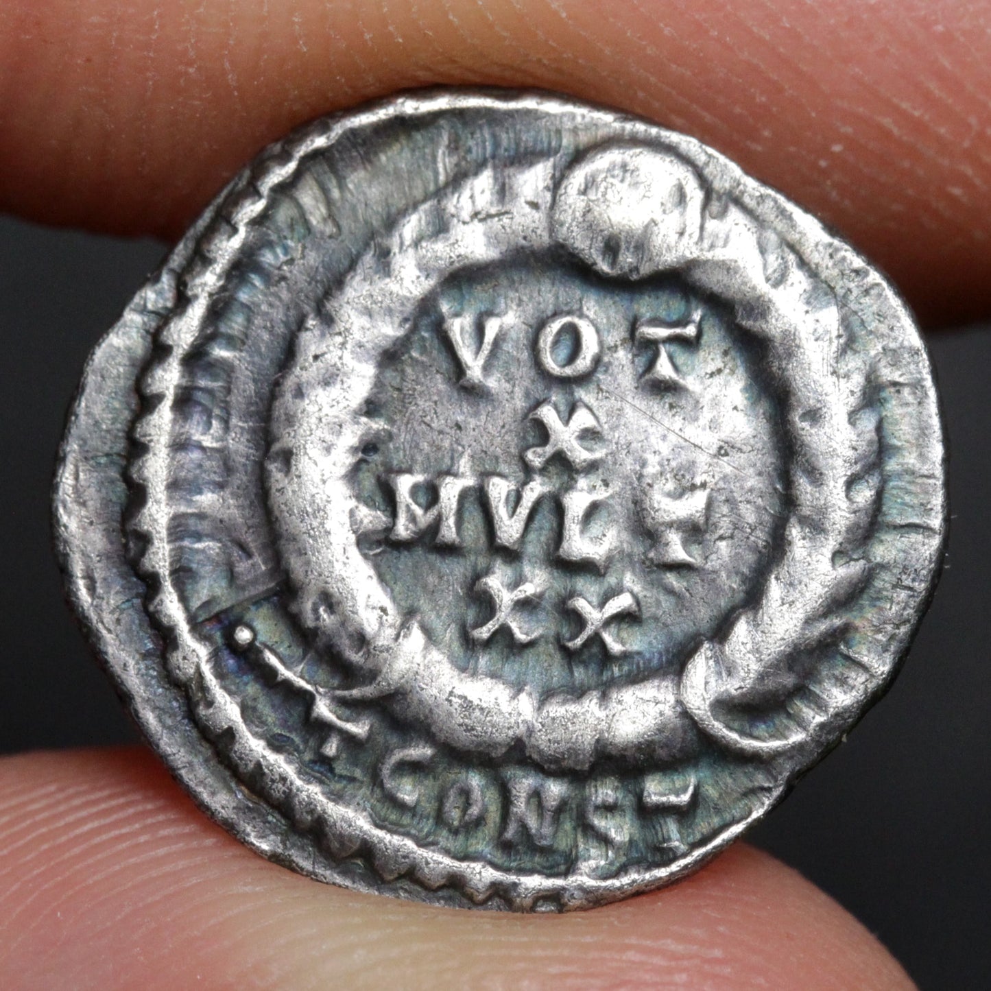 julian the apostate siliqua reverse side held between two fingers