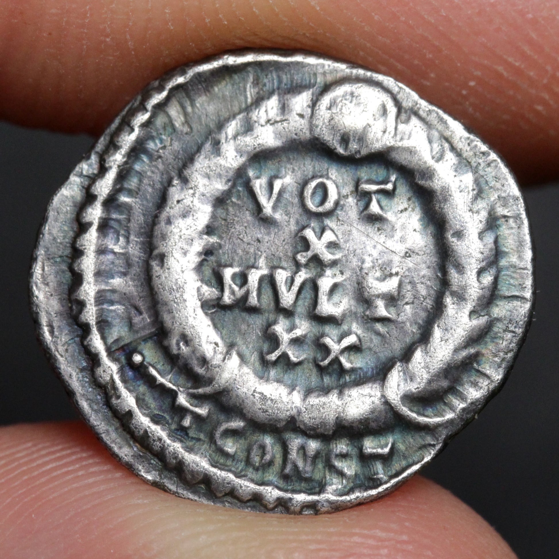 julian the apostate siliqua reverse side held between two fingers