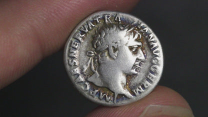 video of ancient Roman silver coin of trajan rotated to show both sides