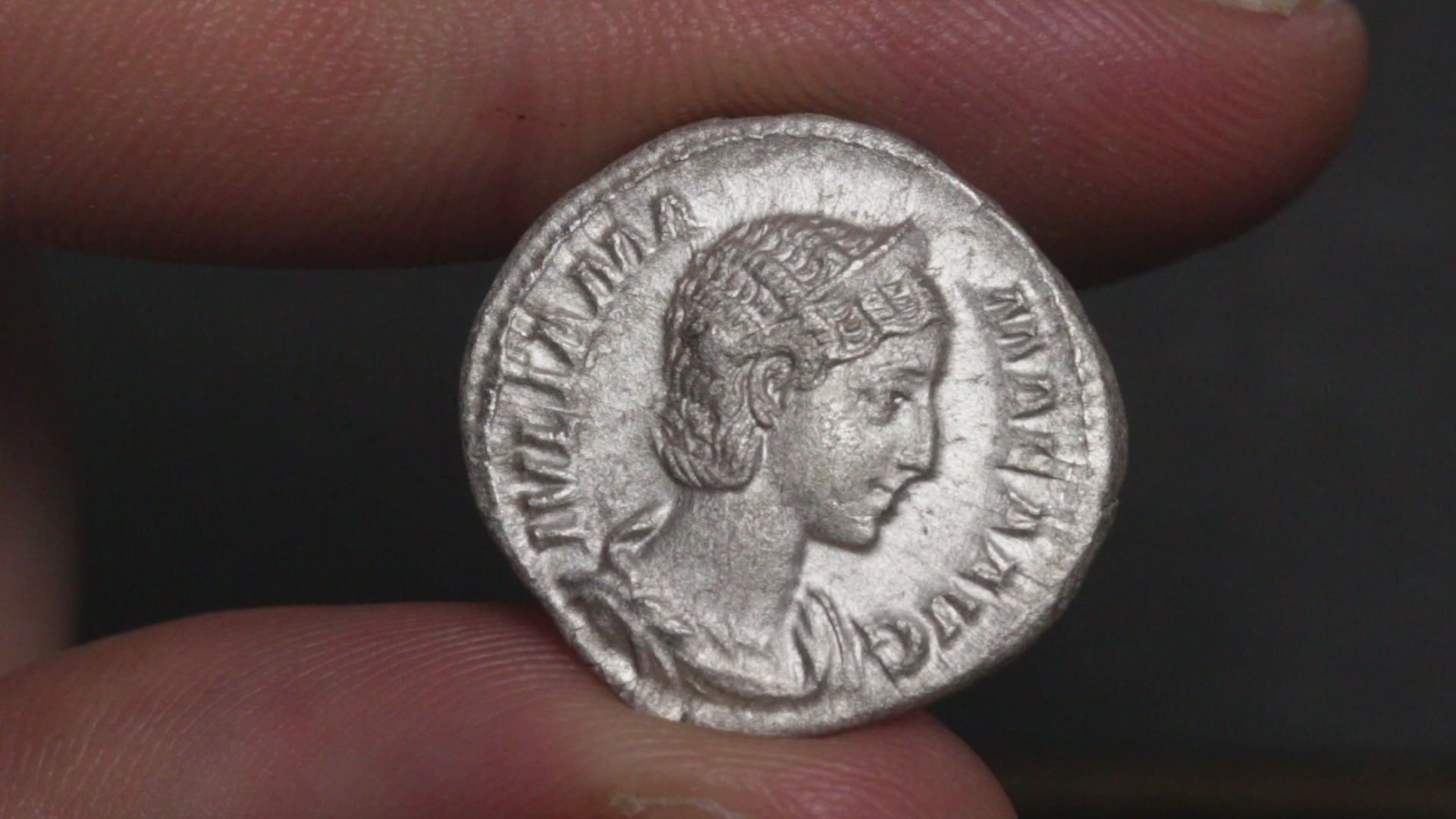 video showing julia mamaea denarius being rotated between two fingers