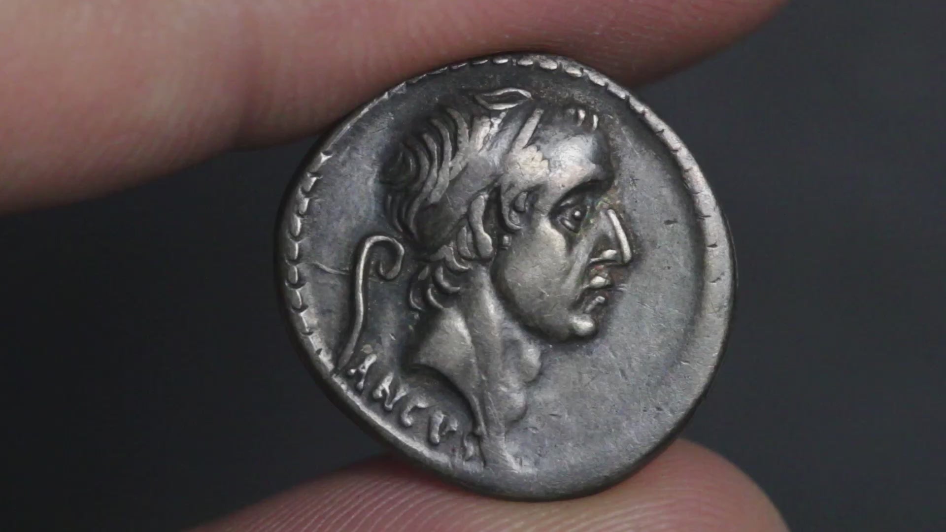 video showing the denarius coin being rotated to display both sides