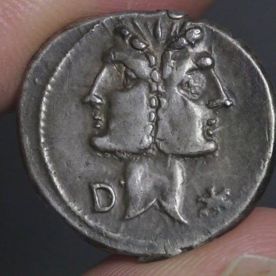 video showing denarius being rotated between two fingers to show both sides