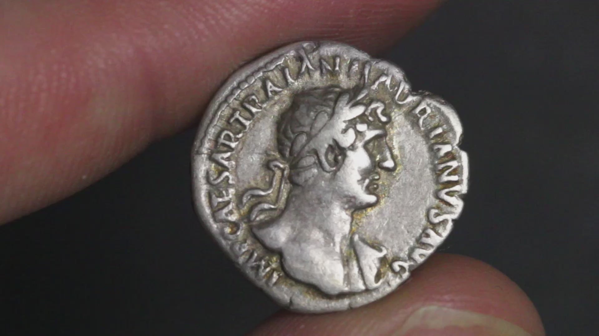 video of hadrian denarius with coin rotated to show both sides