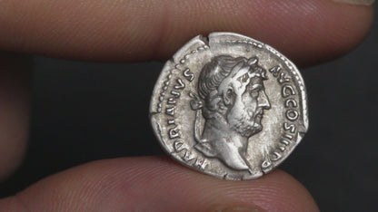 video of hadrian denarius being rotated between two fingers to show both sides
