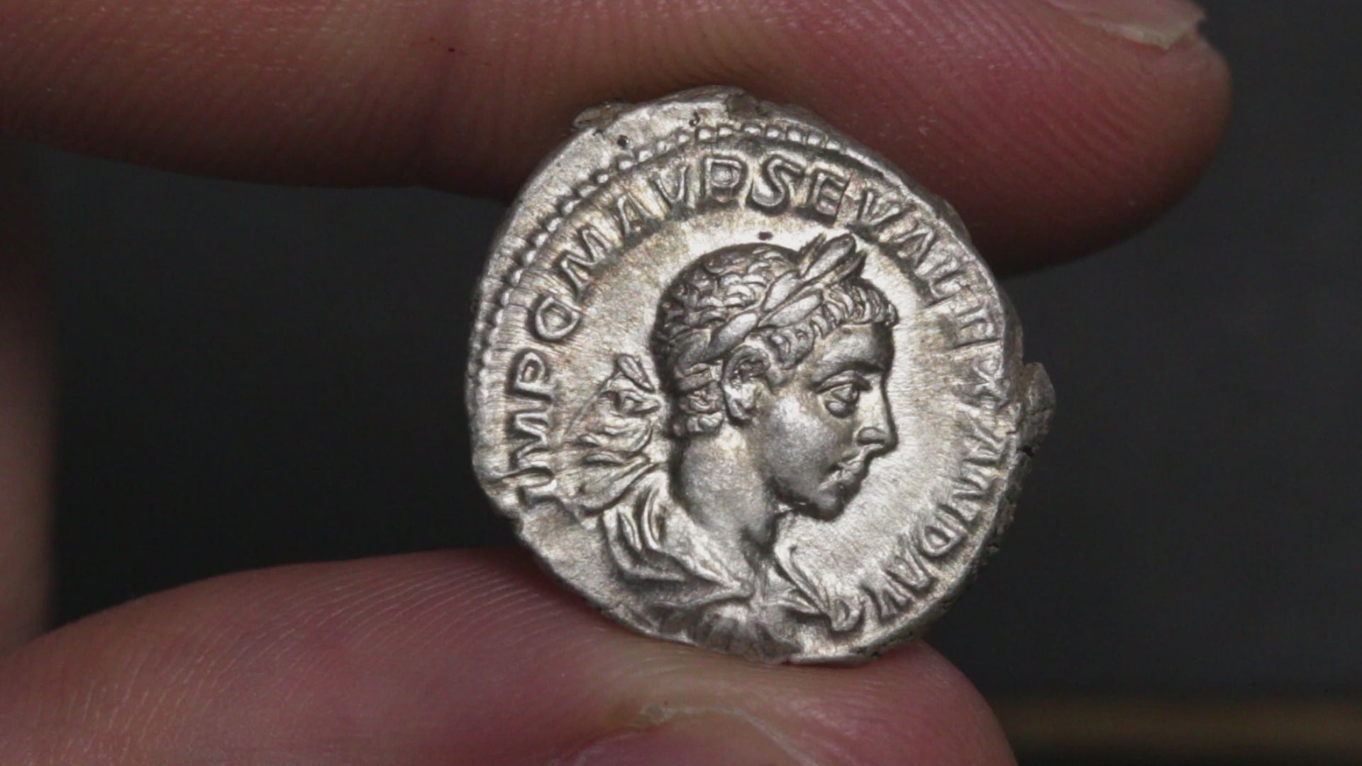 video showing severus alexander denarius being rotated between two fingers