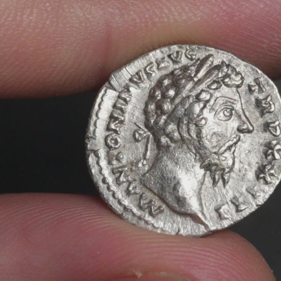 video of marcus aurelius denarius being rotated between two fingers to show both sides