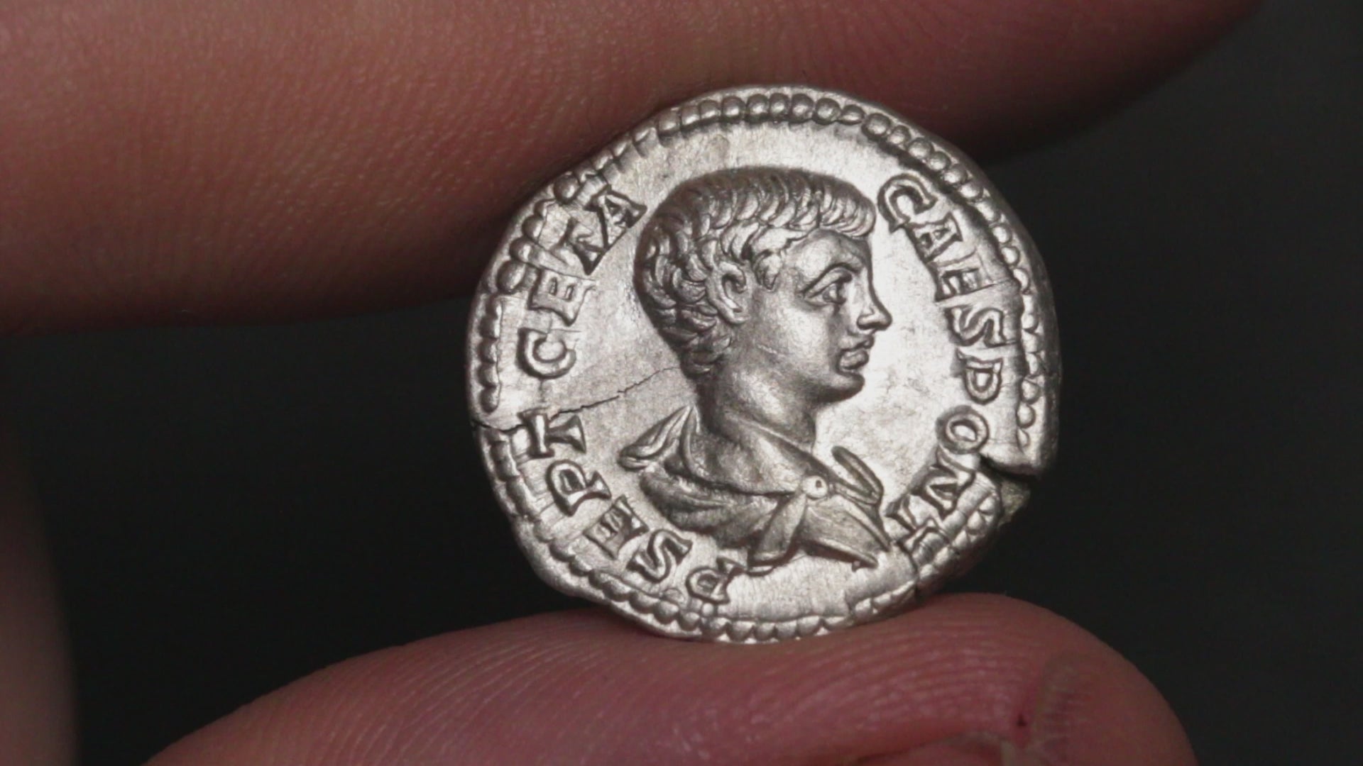 video of geta denarius being rotated between fingers to show both sides