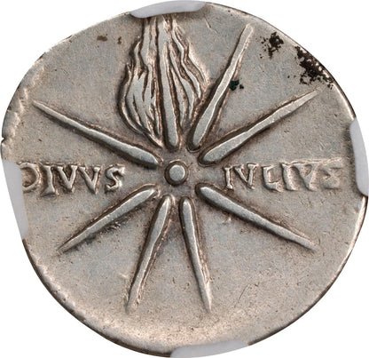 Ancient silver coin with star design and inscriptions on a white background