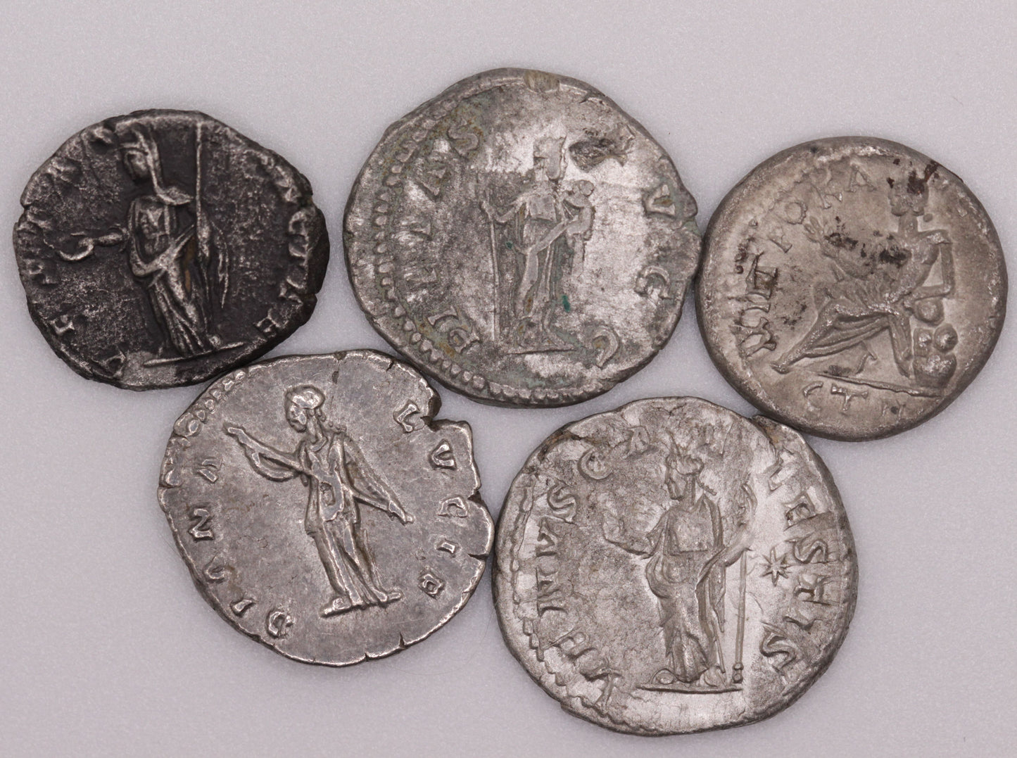 The reverse side of Roman denarius coins, featuring Roman goddesses